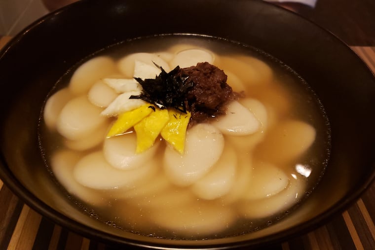 Tteokguk, a traditional Korean rice cake soup.