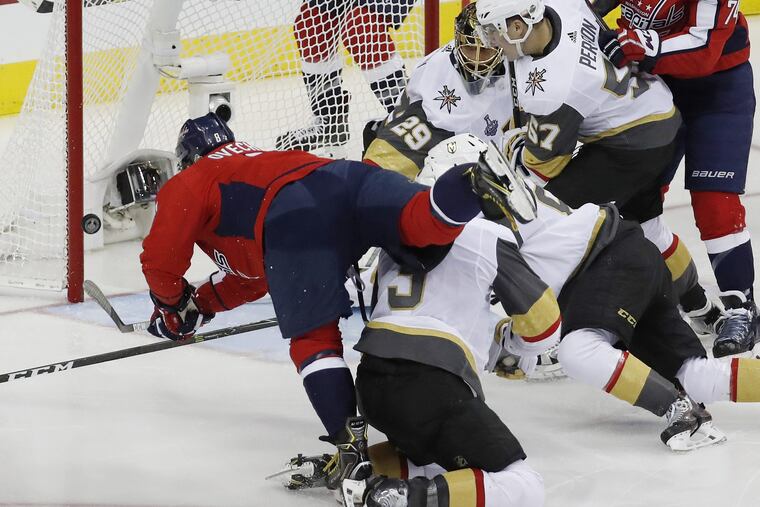 Washington's relentless left winger, Alex Ovechkin, goes over Vegas defenseman Brayden McNabb to score the first goal in the host Capitals' workmanlike 3-1 win in Game 3 on Saturday.