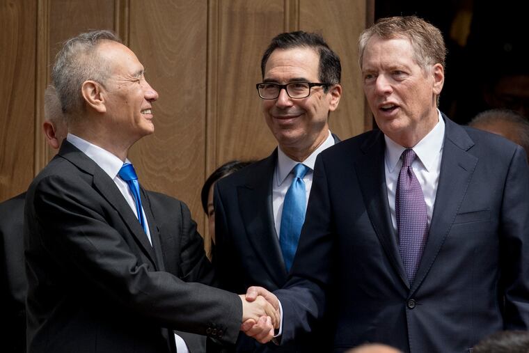 Treasury Secretary Steve Mnuchin, center, and United States Trade Representative Robert Lighthizer, right, speak with Chinese Vice Premier Liu He, left, as he departs the Office of the United States Trade Representative in Washington, Friday, May 10, 2019.