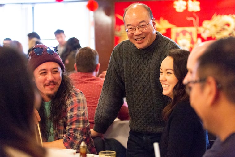 Evan Liu, a Center City lawyer and physician, shared one last meal at the Imperial Inn with children Chris (left) and Brenna on Sunday before the Chinatown institution closed after more than 45 years. Chris flew in from Colorado for the meal, and brother Robert drove down from Vermont.