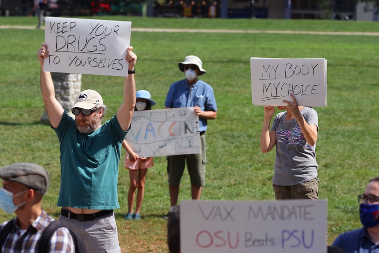 An anti-vaccination rally on Penn State's campus in State College in August. Unvaccinated people being treated for COVID-19 are primarily responsible for shortages of some medicines — including a drug required by the author.