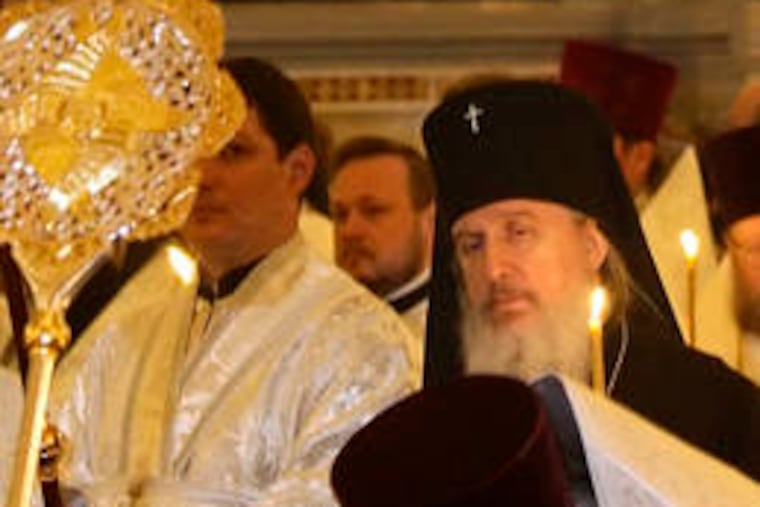 Russian Orthodox church members, at Christ the Savior Cathedral in Moscow, mourn the death of Patriarch Alexy II, who died Friday.