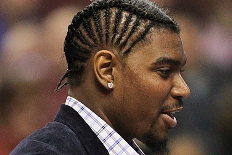 In the latest update on Andrew Bynum, provided by him Monday before the 76ers hosted the Orlando Magic, the center said the target date for him to debut with the team is still sometime this month. (Steven M. Falk/Staff Photographer)