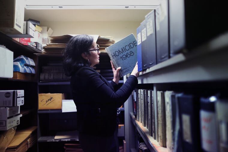 Detective Norma Seranno looks through the historic H-Files – H for Homicide – locked away in a closet at Police headquarters.