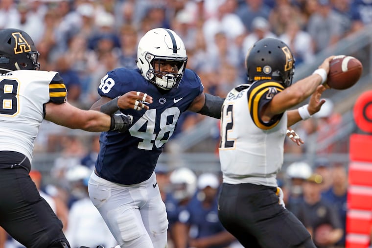 Penn State's Shareef Miller (48) goiing after Appalachian State quarterback Zac Thomas (12) during the second half Saturday.