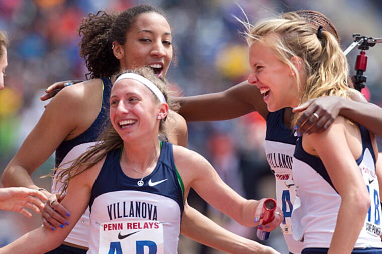 Villanova's Emily Lipari (left) celebrates with her teammates after crossing the finish line. (Ed Hille/Staff Photographer)