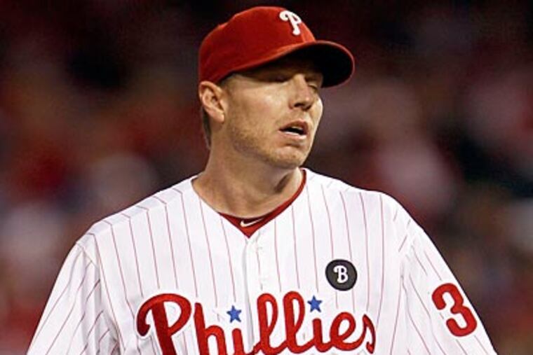 Roy Halladay reacts during the Phillies' 1-0 loss in Game 5 of the National League Division Series. (Yong Kim/Staff Photographer)