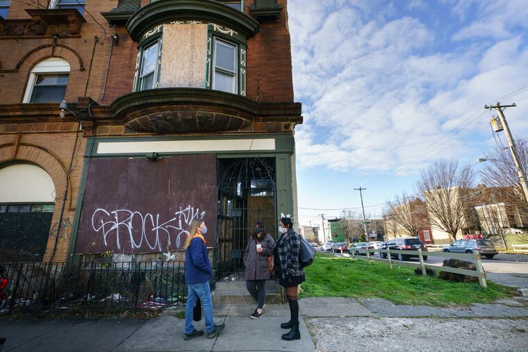 Chris Mulford (from left), Dana Rice, and Maya Thomas, preservationist activists, meet in front of the Dox Thrash House in Philadelphia. The pioneering painter's former home in Sharswood will get a second life with preservationists acting as investor-partners.