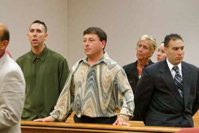 Convicted bookmaker Jack Buscemi (center, patterned shirt) during court proceedings last year. (David M Warren / Staff Photographer)