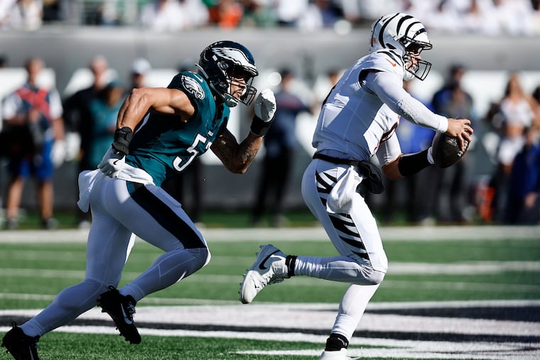 Eagles linebacker Zack Baun chases Bengals quarterback Joe Burrow during last season's matchup in Cincinnati.