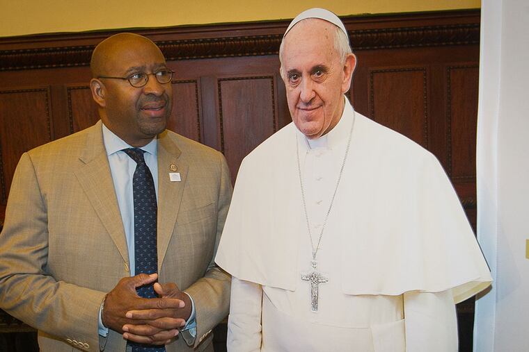 Mayor Nutter poses beside a cardboard likeness of Pope Francis. (ALEJANDRO A. ALVAREZ/Staff Photographer)