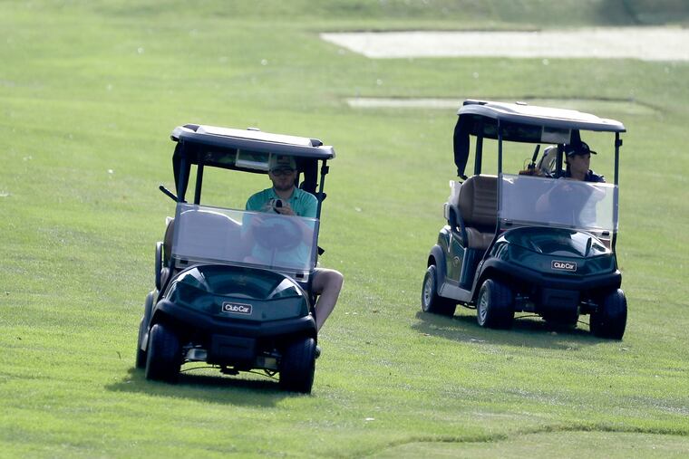Golfers Michael O’Brien of West Chester, Ohio (left) and Zach Barbin of Elkton, Md., drive their carts at the Lancaster Country Club during the Golf Association of Philadelphia BMW Philadelphia Amateur Championship match in June. The golfers were allowed to use carts instead of caddies due to the Golf Association of Philadelphia's COVID-19 social distancing rules.