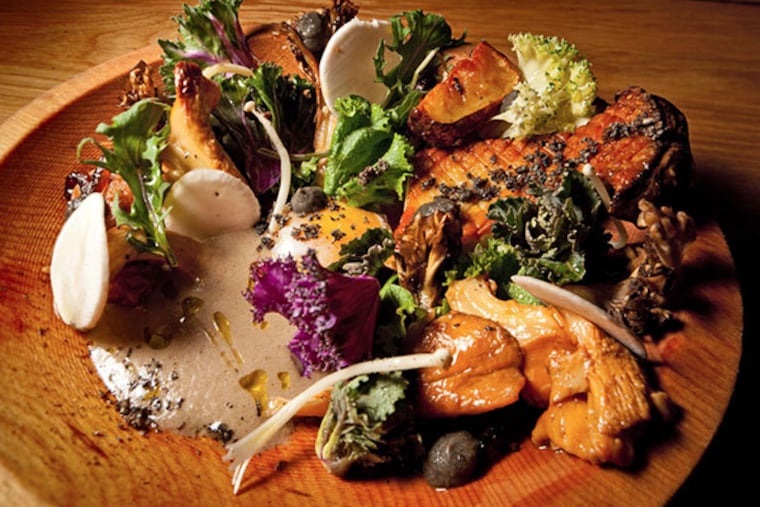 A medley of exotic mushrooms is served with sunchokes, smoky eggplant, young kale, and a farm-fresh egg at High Street.