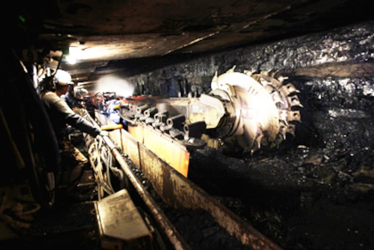 The cutting wheel of a longwall mining machine digs out coal from Cumberland Mine in Waynesburg, Pa. Coal feeds 53 percent of the state's electricity-generation needs. (Laurence Kesterson/Staff)