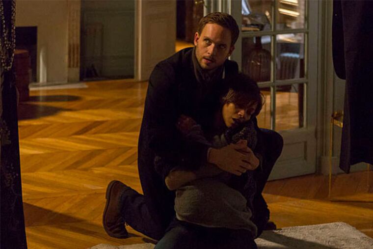 Patrick J. Adams, above as Guy, with Zoe Saldana, as Rosemary. See the baby bump? At right are the creepy new pals, Carole Bouquet and Jason Isaacs. (Roger Do Minh/NBC)