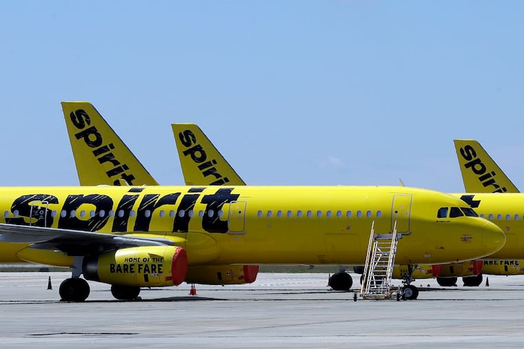 A line of Spirit Airlines jets sit on the tarmac at Orlando International Airport in May 2020.