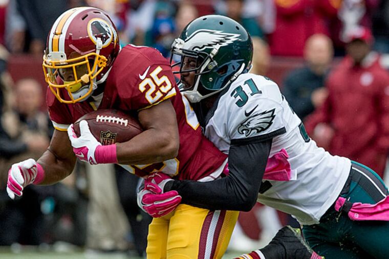 Washington running back Chris Thompson is brought down by Eagles
cornerback Bryon Maxwell.