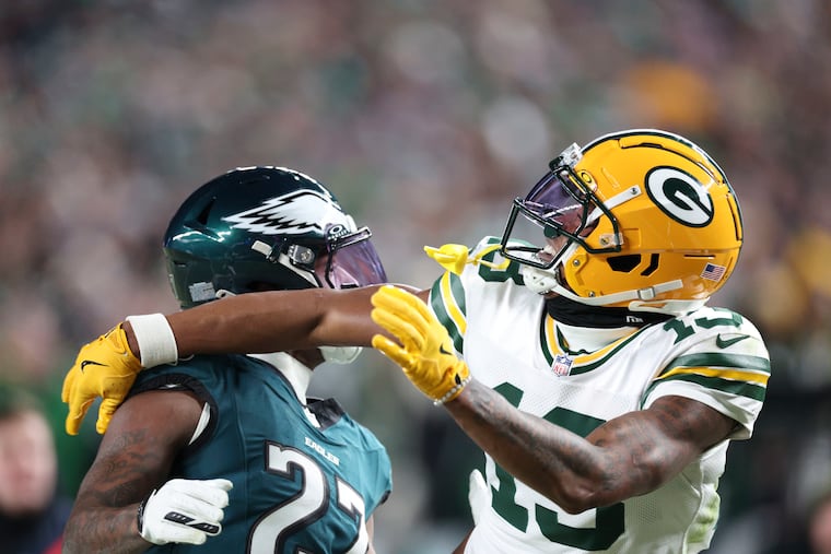 Then with the Packers, wide receiver Dontayvion Wicks draws a penalty on Eagles cornerback Quinyon Mitchell during their playoff game on Jan. 12.