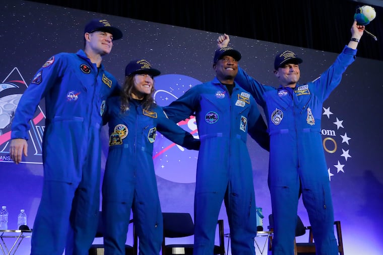 The Artemis II crew — Jeremy Hansen (from left), Christina Koch, Victor Glover, and Reid Wiseman — take center stage Saturday at Ellington Field in Houston.
