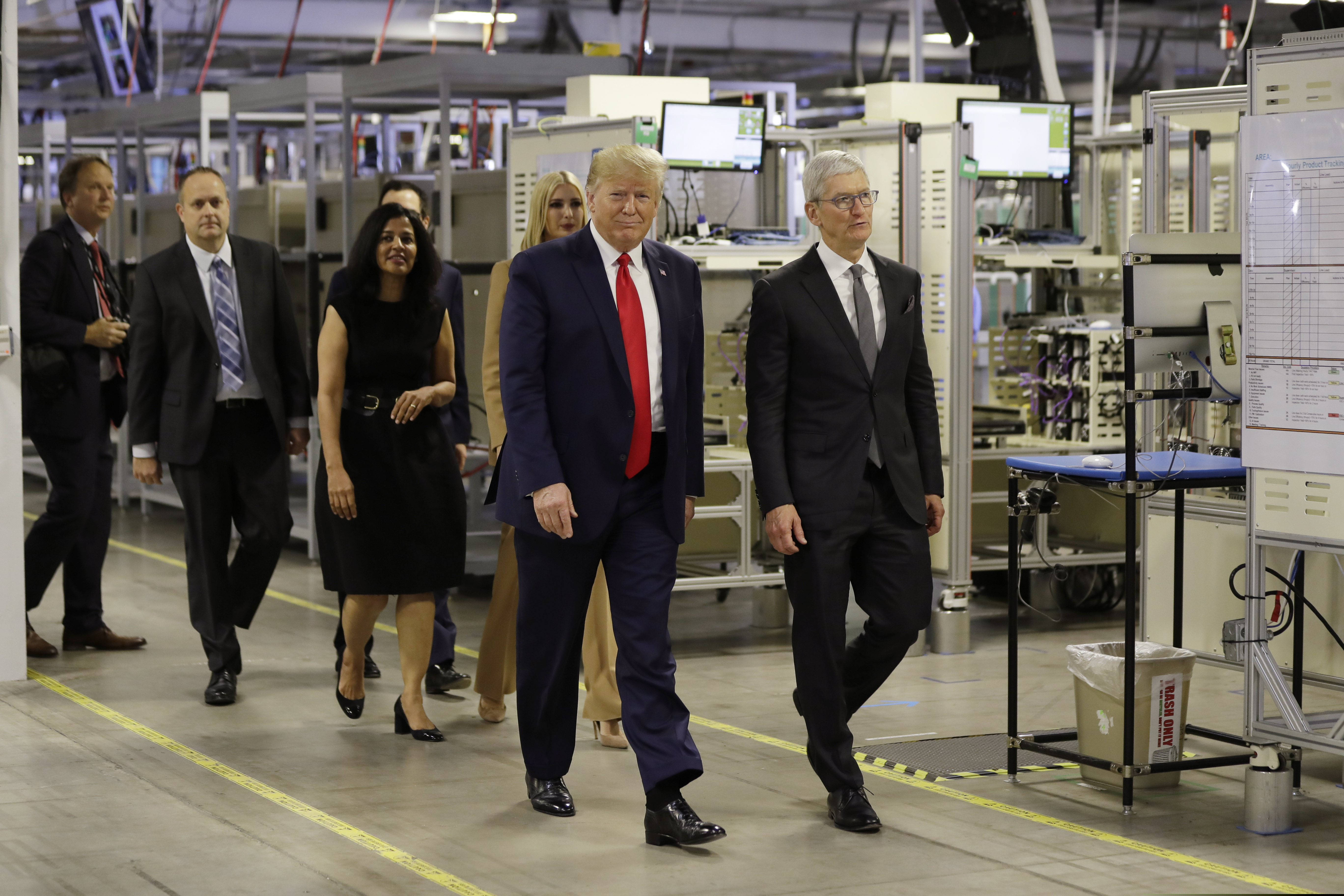 President Donald Trump tours an Apple manufacturing plant, Wednesday, Nov. 20, 2019, in Austin with Apple CEO Tim Cook, Ivanka Trump, the daughter and adviser of President Donald Trump and others.