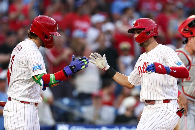 Trea Turner (right) scored the Phillies' lone run of the game with his solo shot in the third inning on Tuesday.