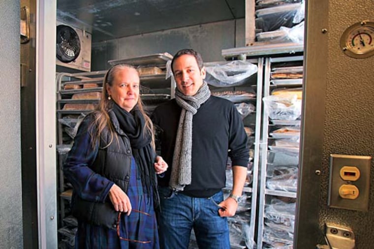 Wednesday, February 12, 2014 Patricia Blakely, executive director of The Merchants Fund, left with Jim Hausman, owner of Swiss Haus Bakery in center city, stand inside the bakeries walk=in freezer, a purchase that was made possible by Blakely and her fund. ( Ed Hille / Staff Photographer)