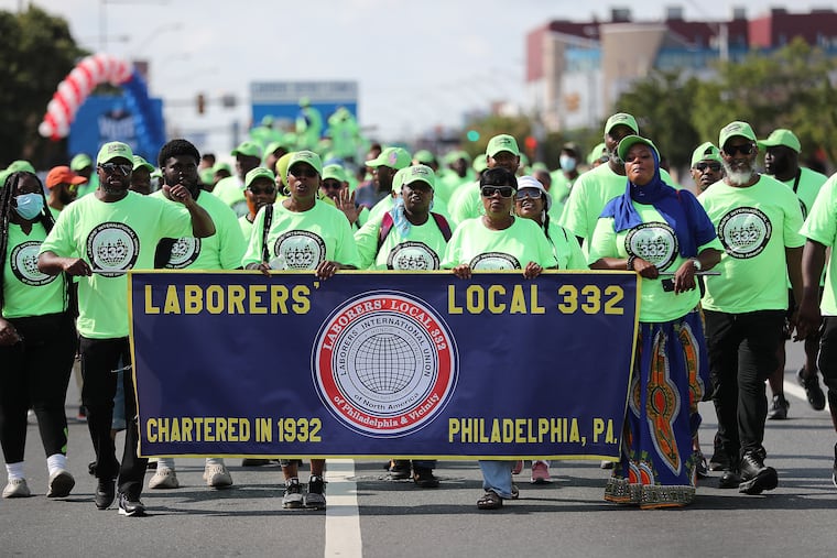 Members of Laborers’ Local 332 march in the annual Labor Day Parade in Philadelphia on Monday.