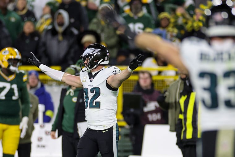 Eagles safety Reed Blankenship celebrates after breaking up a pass on fourth down in the third quarter on Monday against the Green Bay Packers at Lambeau Field.