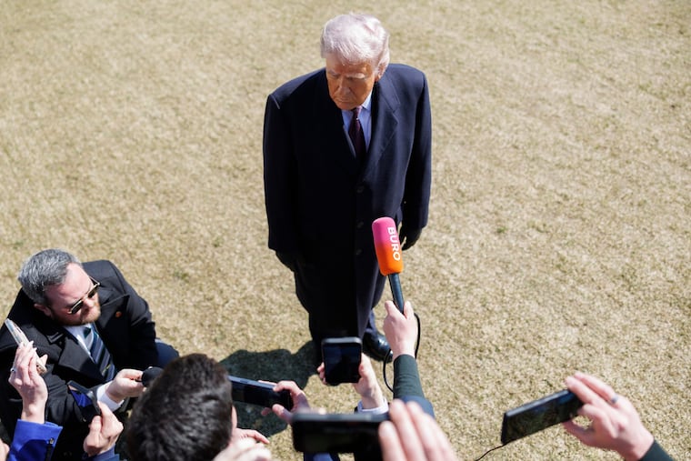 President Donald Trump speaks to reporters Friday before departing on Marine One from the South Lawn of the White House.