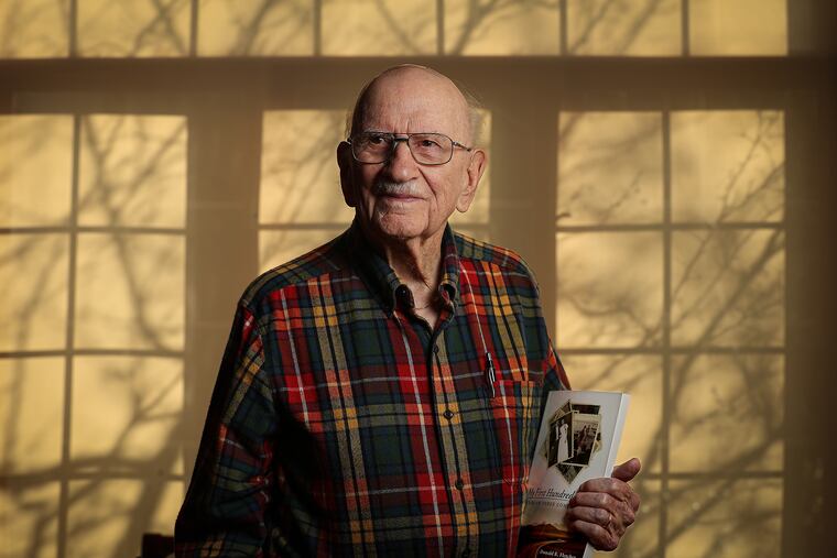 Donald R. Fletcher, 101 years-old, who lives in the Lions Gate retirement community, poses for a portrait in Voorhees Township, NJ on January 15, 2020. He is holding a copy of his recently published book, “My First 100 Years: A Life on Three Continents.”