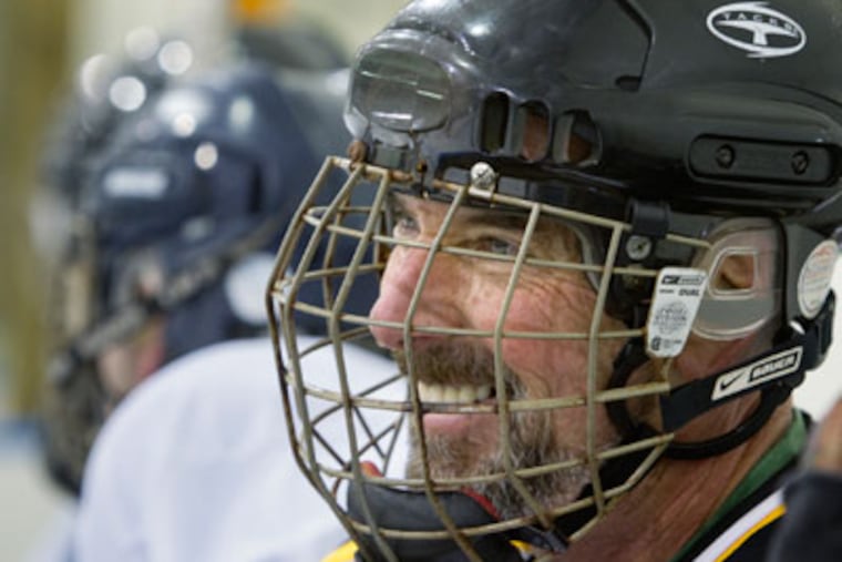 Frank Clamer, 53, of West Chester, smiles while waiting for a line change on the bench. (Ed Hille / Staff Photographer)