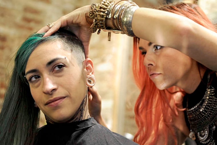 Roybal under the razor , getting half her head shaved by Jessica Jane at Parlour.