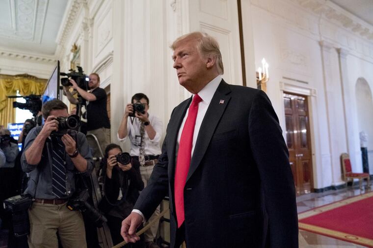 President Donald Trump arrives to award the Medal of Honor posthumously to Air Force Tech. Sgt. John A. Chapman, for conspicuous gallantry during a ceremony in the East Room of the White House in Washington, Wednesday, Aug. 22, 2018.