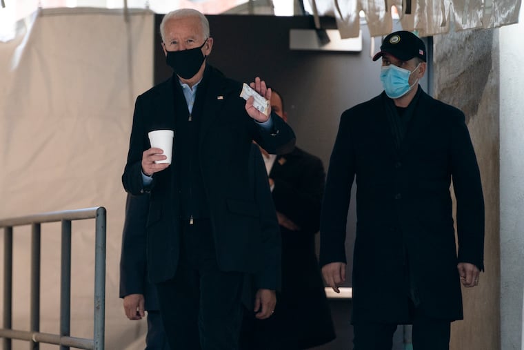 President-elect Joe Biden waved to reporters as walked out of The Queen theater Monday in Wilmington.