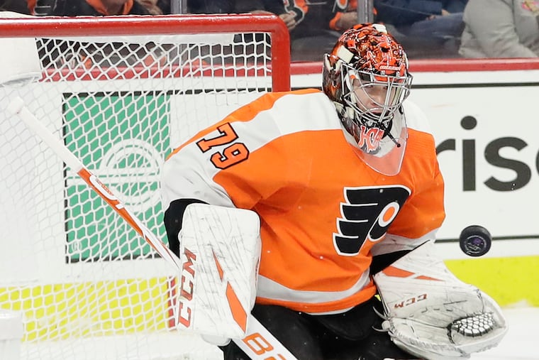 Flyers goaltender Carter Hart making a save against Boston last season.