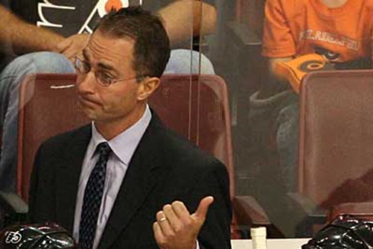 Flyers coach John Stevens is pushing the Flyers to play hard for the entire game. Their inconsistent play could threaten his future as coach of the Flyers. (Yong Kim / Staff Photographer )