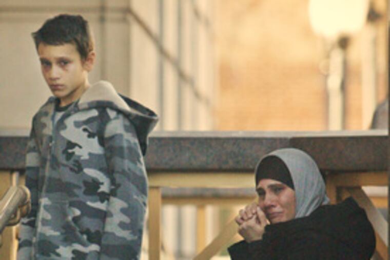 Outside the federal courthouse in Camden, a young woman cries after yesterday's guilty verdicts in the plot to attack Fort Dix.