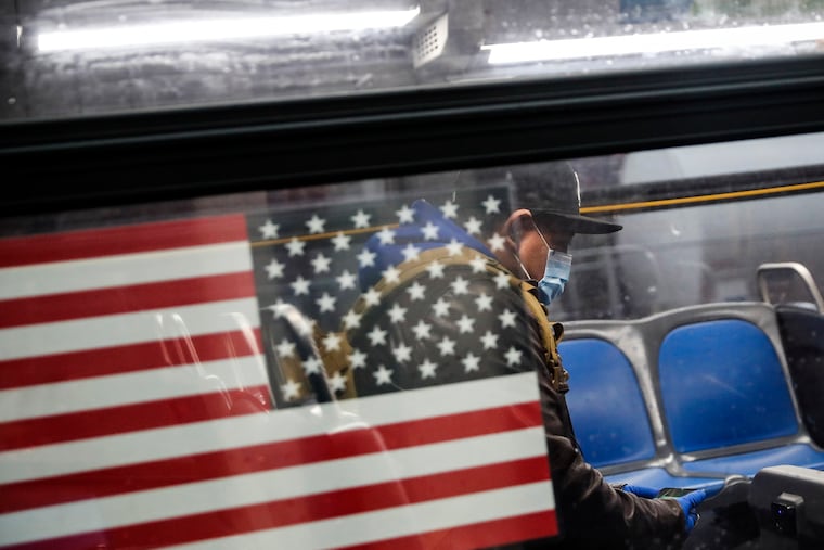 A customer wears personal protective equipment while riding an MTA bus as it operates without fees in the Bronx borough of New York City. An increasingly dire financial situation brewing for New York’s MTA has called attention to its spending across the U.S.