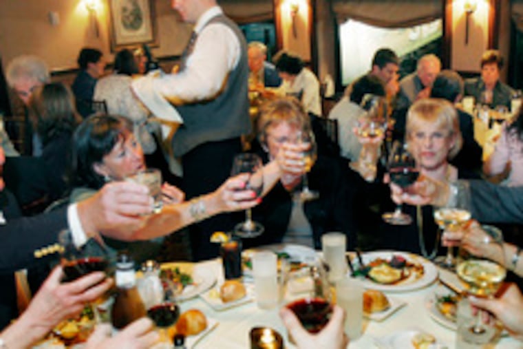 Toasting the future, members of the Culinary Society of Philadelphia enjoy a last meal at the Moshulu.