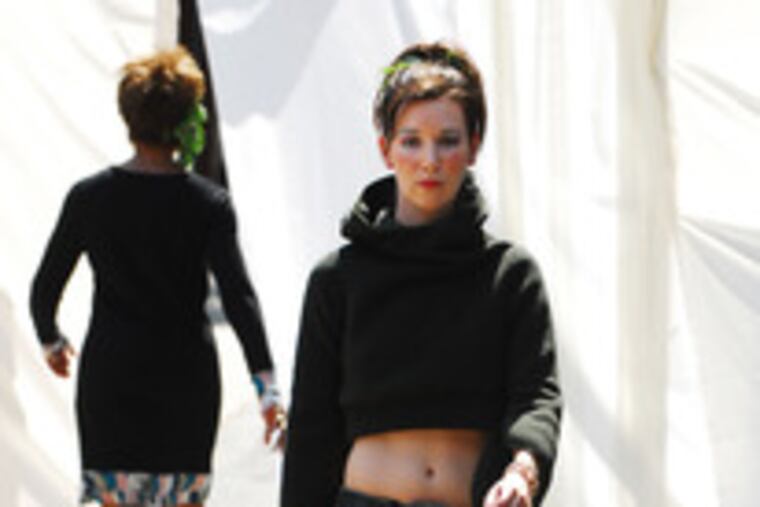 Michelle Dewey's top is by Carol Young;jeans by Tierra del Forte; bag by Ecoist.