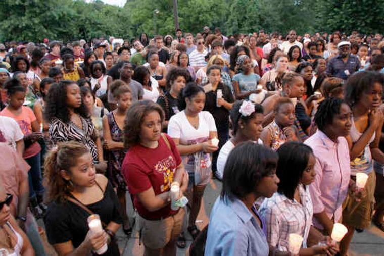 Friends of Shakuwrah Muhammad attend candlelight vigil at Central High School, her alma mater.