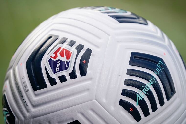 A soccer ball sits by the pitch line prior to the NWSL Championship soccer match between the Washington Spirit and Chicago Red Stars, Nov. 20, 2021, in Louisville, Ky. The U.S. Soccer Federation and the union for its women's national team agreed to a three-month extension of their labor contract through March, a move announced on the same day players filed a brief asking a federal appeals court to reinstate their equal pay claim. (AP Photo/Jeff Dean, file)