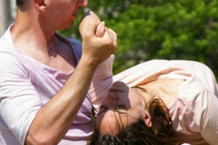 Alexander Short and Jennifer Rivers, of Human Landscape Dance company, use Clark Park as their stage.