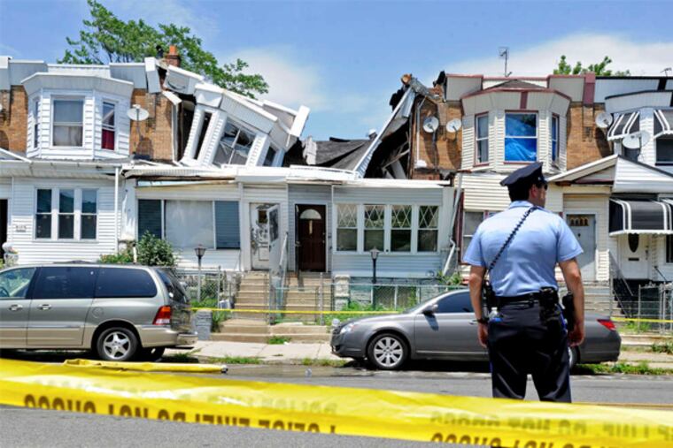 The rowhouses in the 6000 block of Spruce Street. It appeared a faulty party wall was to blame.