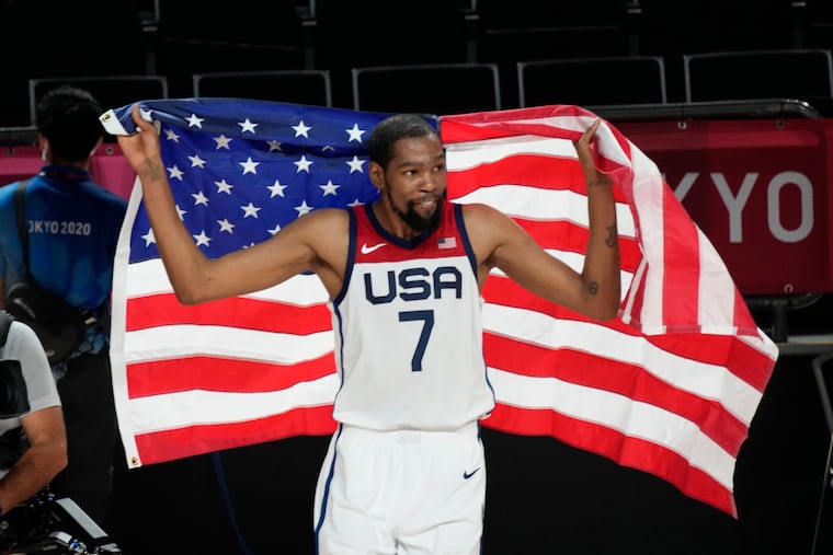 United States' Kevin Durant (7) celebrates after their win in the men's basketball gold medal game against France at the 2020 Summer Olympics, Saturday, Aug. 7, 2021, in Saitama, Japan.