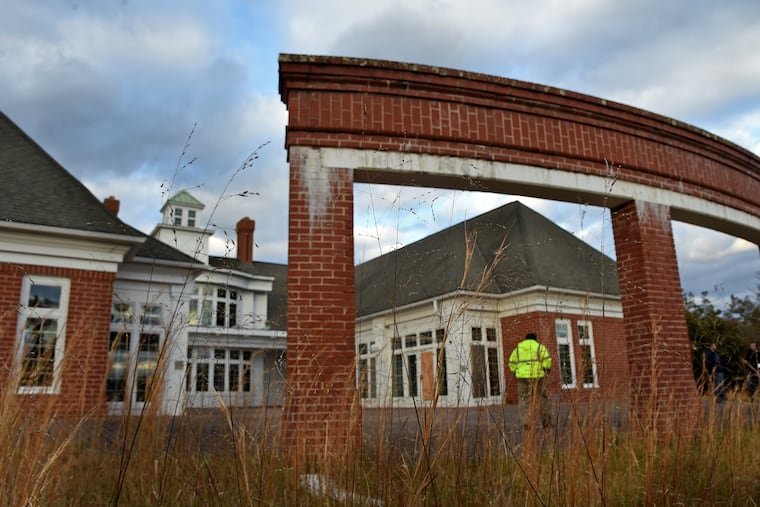 Atlantic City Electric senior real estate representative Mike Powers walks behind the abandoned Brian A. Parent Conference Center on the 1,400-acre Holly Farm site in Millville. Located between the Manumuskin and Menantico Creeks — both federally designated Wild and Scenic Rivers — the land is earmarked for preservation.