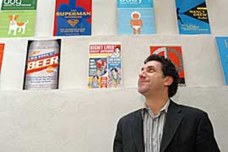 David Borgenicht, who founded Quirk Books in 2002, with a display of titles published. He’d scored a hit with “Worst-Case Scenario Survival Handbook,” which he co-wrote. (April Saul / Inquirer)