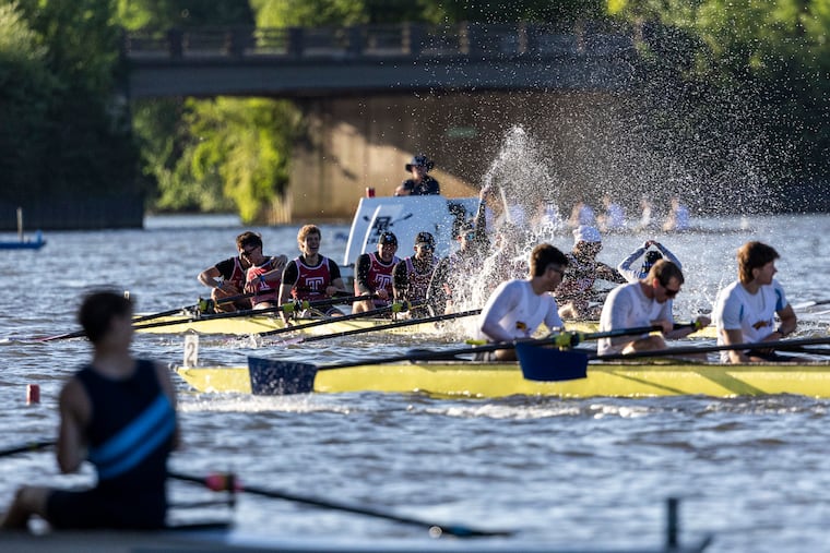 Members of Temple's men’s varsity eight celebrate after the final at the Dad Vail Regatta on the Cooper River on May 10.