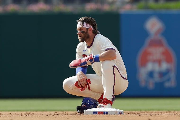 Bryce Harper rests at second base during a break in the action against the Miami Marlins in Game 1 of a doubleheader on July 16,.