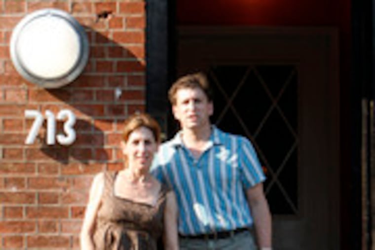 Jackie Promisilo and her husband, John Steinhouse, with daughter Julia and son Jordan outside LolliLolli. She said she might return to practicing law someday.